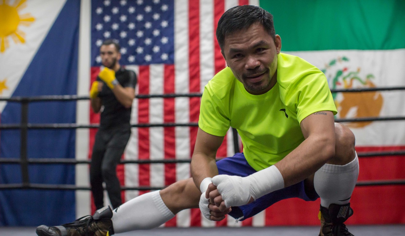 Manny Pacquiao stretches before his workout at Wild Card Gym in Hollywood. Photo: AFP