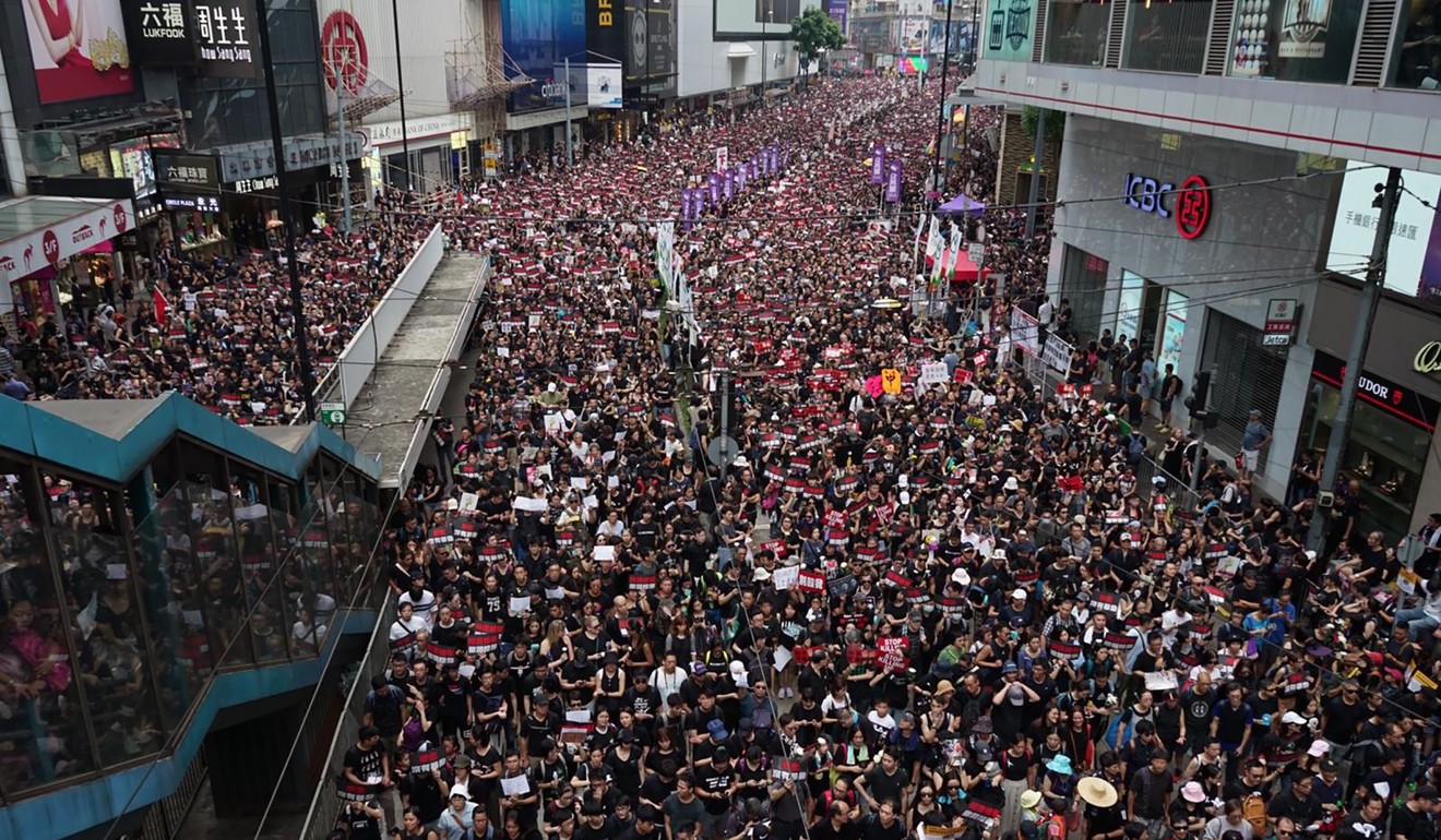 Hennessy Road near Causeway Bay is a complete sea of black as Hongkongers of every age, profession and background march in a massive show of solidarity and defiance against the extradition bill. Photo: Joanne Ma