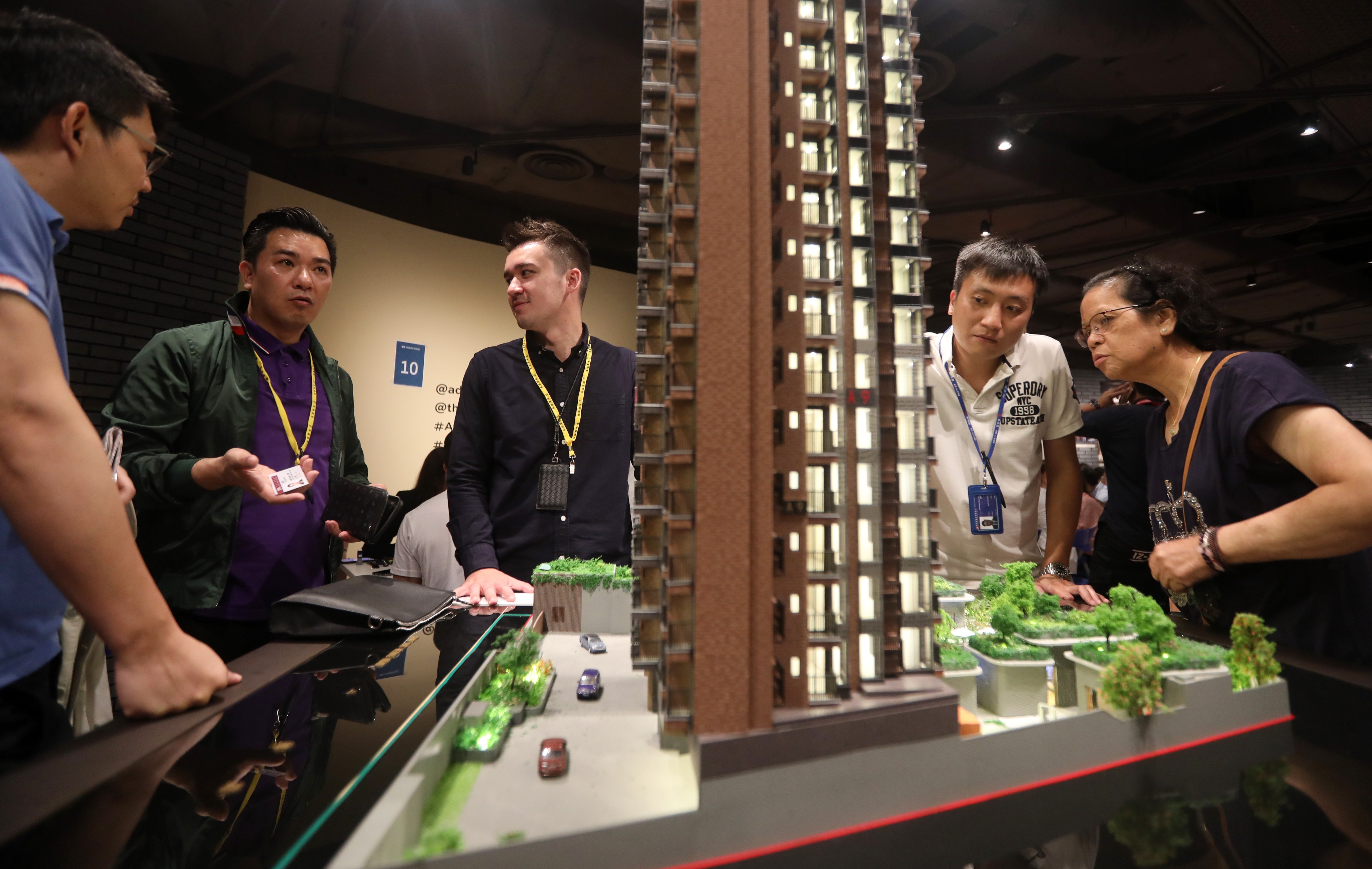 Potential buyers viewing a model of New World Development's Atrium House project on 22 June 2019. Photo: SCMP / Xiaomei Chen