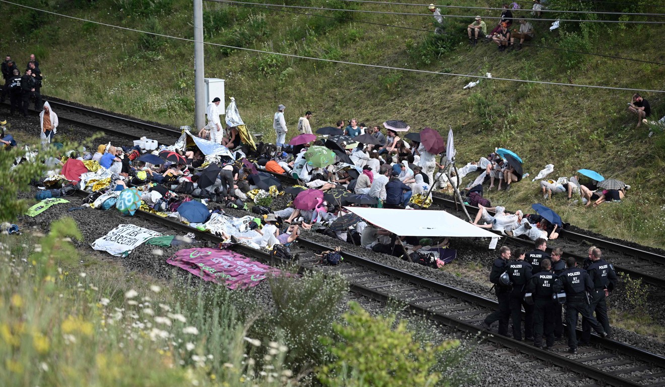Climate activists block the Hambach train line leading to the Hambach lignite opencast mine. Photo: AFP