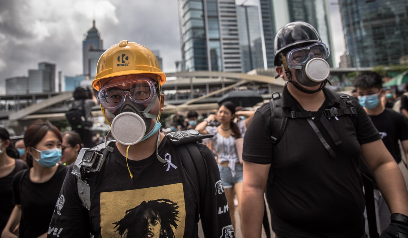 Protesters block a main road outside government buildings in Hong Kong on June 21. Photo: EPA