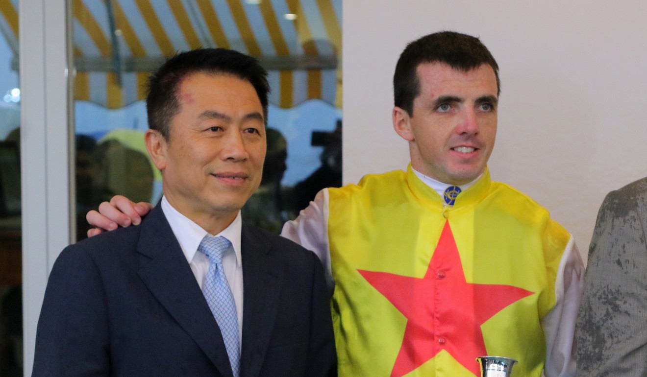 Trainer Ricky Yiu and jockey Martin Harley celebrate a winner together at Sha Tin.