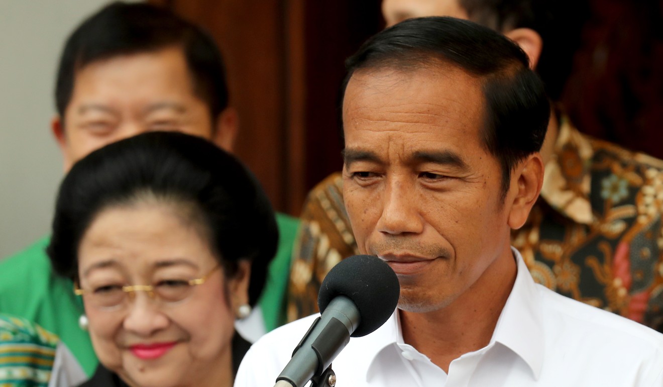 President Joko Widodo is declared the winner of the April polls by the election commission on May 22. Photo: EPA