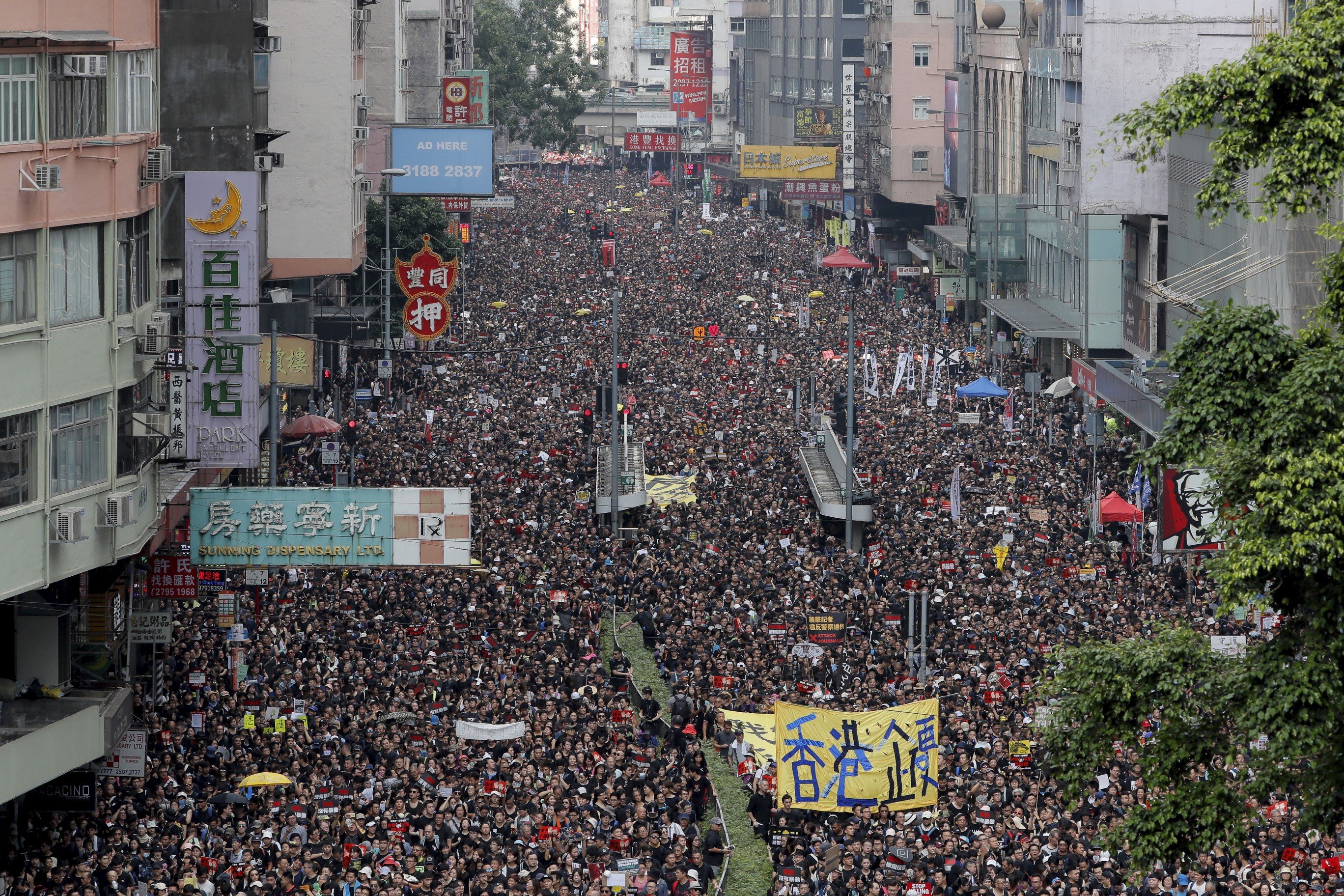 Tens of thousands of protesters march through the streets to demonstrate against the unpopular extradition bill in Hong Kong. Photo: AP