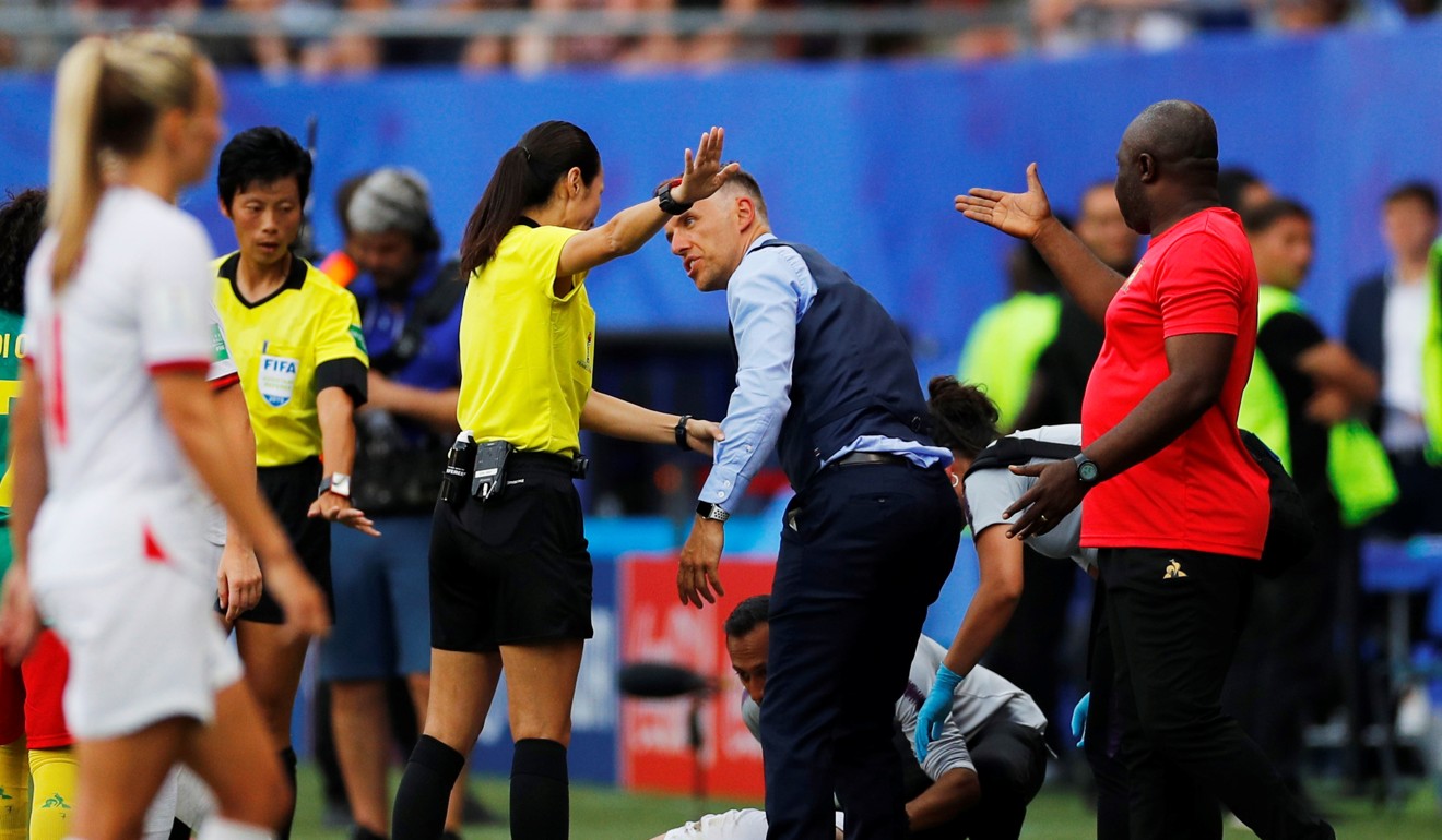 England manager Phil Neville and Cameroon coach Alain Djeumfa react as England’s Steph Houghton receives treatment after a foul. Photo: Reuters