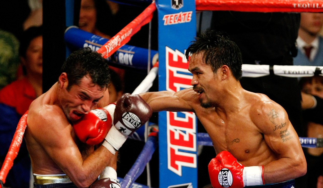 Manny Pacquiao connects with a right to the head of Oscar De La Hoya during their welterweight fight at the MGM Grand Garden Arena in December 2008. Photo: AFP