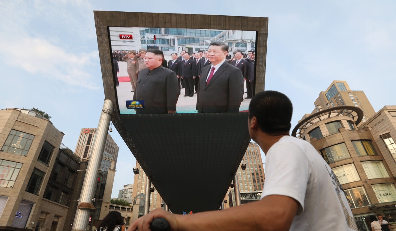 A big screen at a shopping mall in Beijing broadcasts footage of the Chinese leader’s visit to North Korea. Photo: SCMP