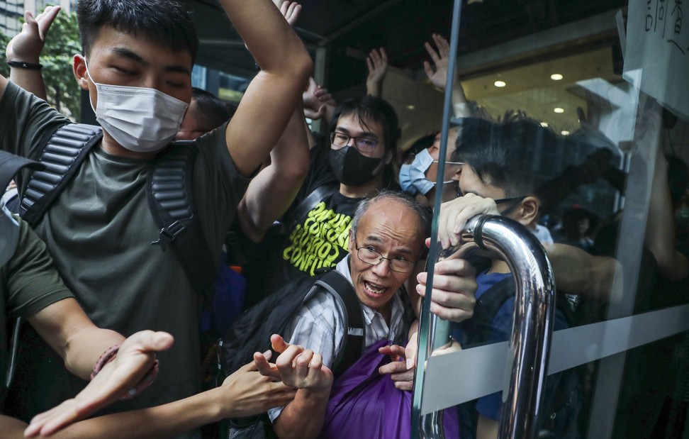 Citizens argue with protesters at the Revenue Tower in Wan Chai on Monday. Photo: Sam Tsang