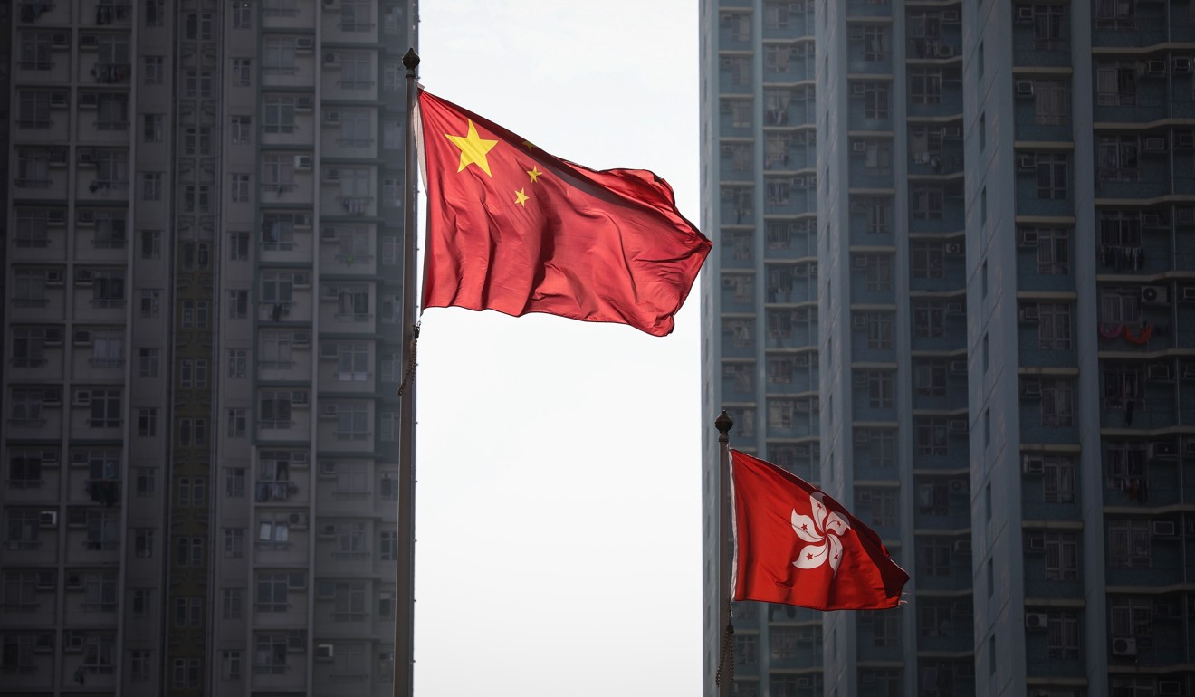 The Chinese and Hong Kong flags outside the West Kowloon Courts in Sham Shui Po. Photo: Roy Issa