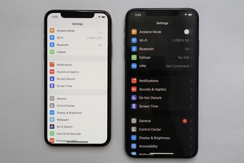 The new dark mode (right) running on an iPhone XS Max, next to an iPhone X running current software. Photo Ben Sin