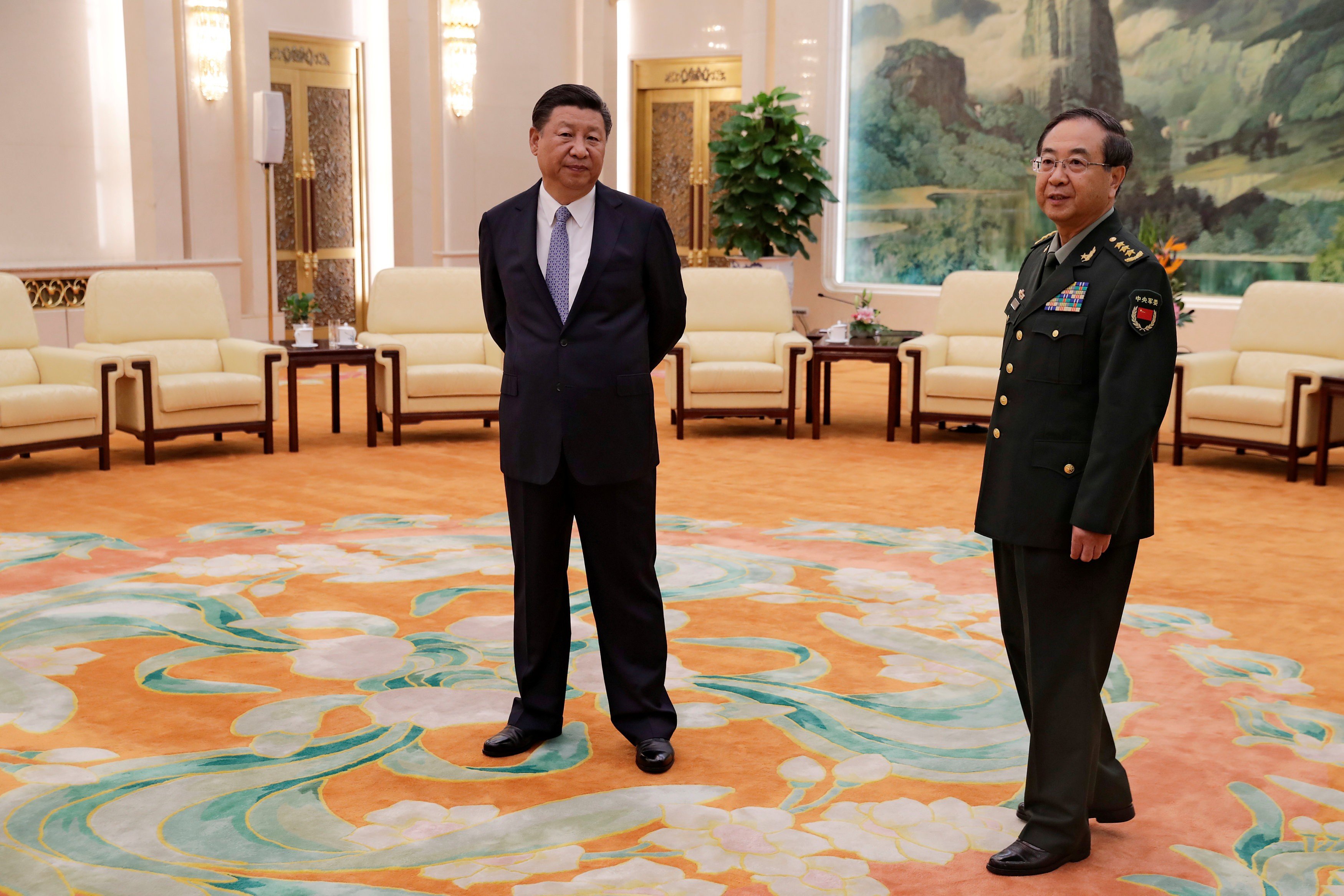 President Xi Jinping and former PLA chief of joint staff Fang Fenghui ahead of a meeting in Beijing in 2017. Fang was jailed for life in February for taking bribes. Photo: Reuters