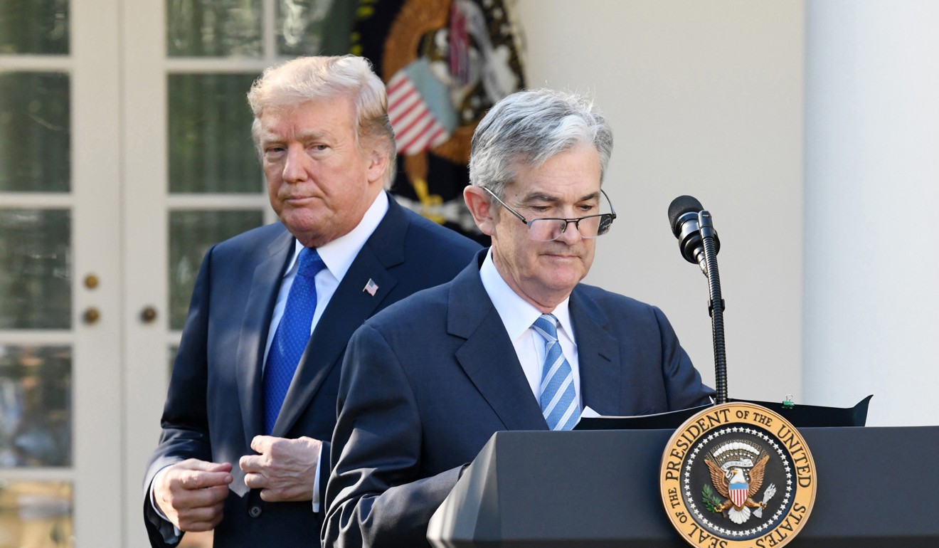 US President Donald Trump walks past Jerome Powell who he nominated to lead the Federal Reserve, at the White House in November 2017. Trump has criticised the Fed for not doing more to stimulate the US economy. Photo: Bloomberg