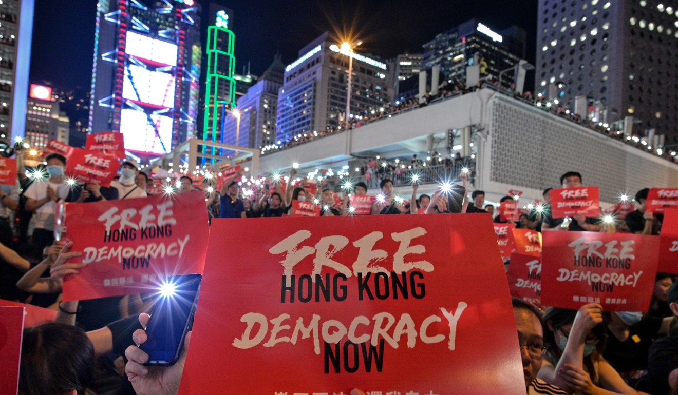 Protesters gather at Edinburgh Place on June 26, calling not only for the withdrawal of the extradition bill and the dropping of charges against protesters but also democracy for Hong Kong. Photo: AFP