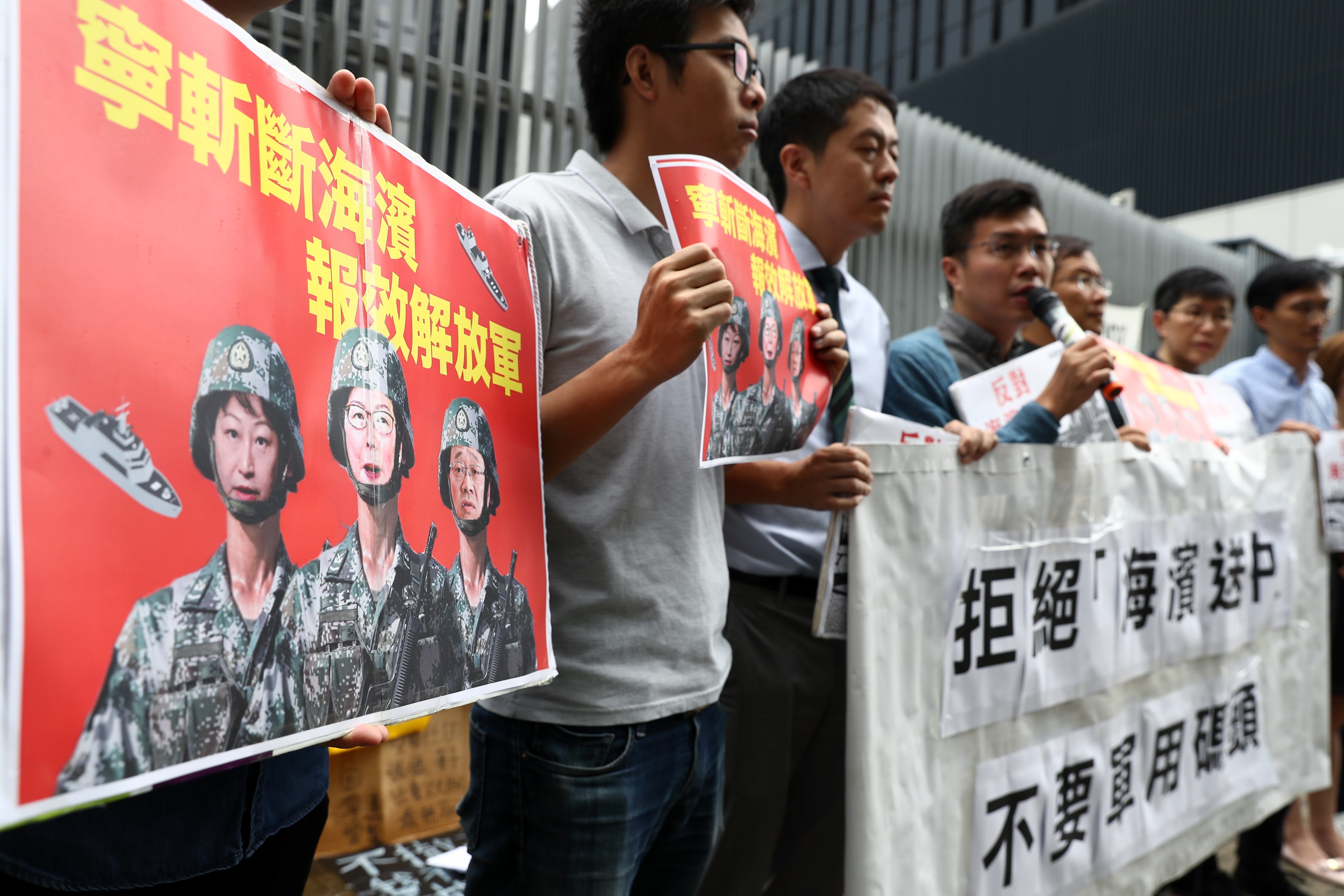 Conservationists protest on Wednesday against a plan to give a stretch of Central waterfront to the People’s Liberation Army. Photo: Nora Tam