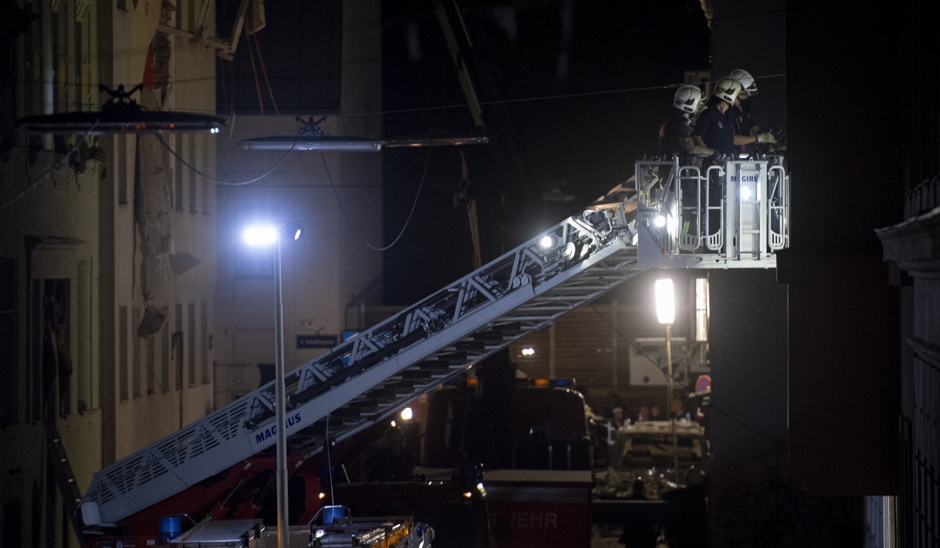 Emergency services personnel at the site of a partial collapsed building in Vienna on Wednesday. Photo: EPA-EFE
