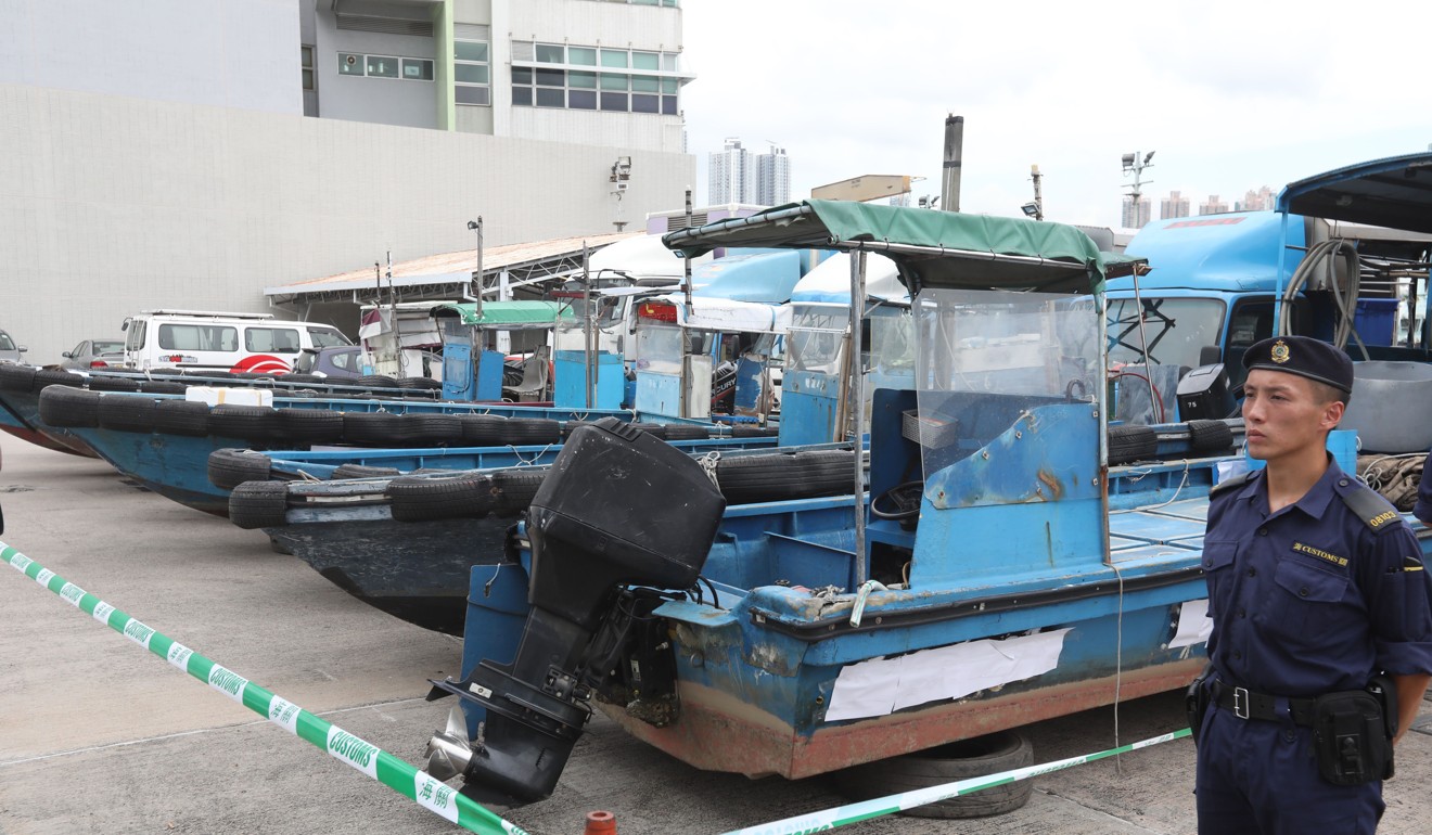 Eight speedboats are held by officers as part of the customs operation. Photo: Nora Tam