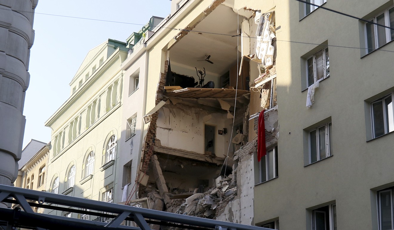 A suspected gas explosion blew a gaping hole in a building in central Vienna on Wednesday. Photo: AP