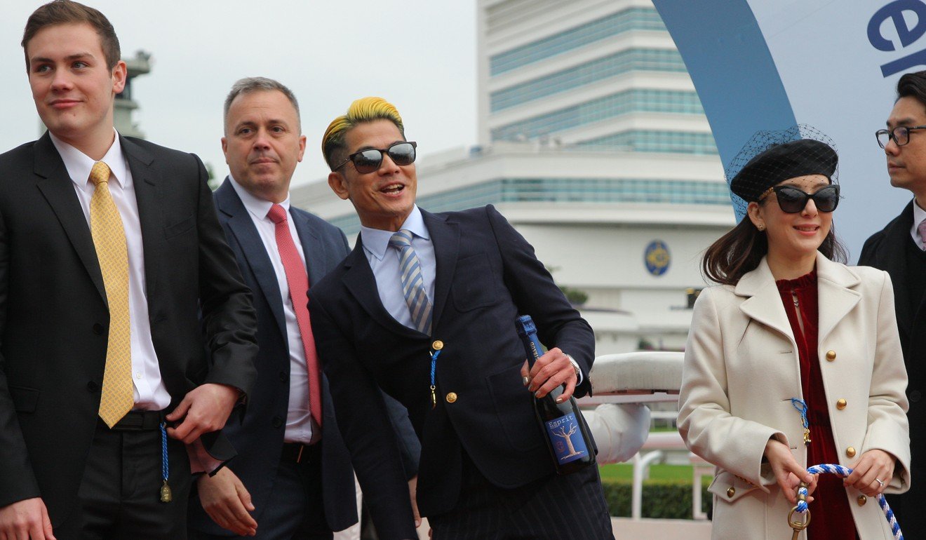 Caspar Fownes celebrates the victory of Dancing Fighter with his owner Aaron Kwok.