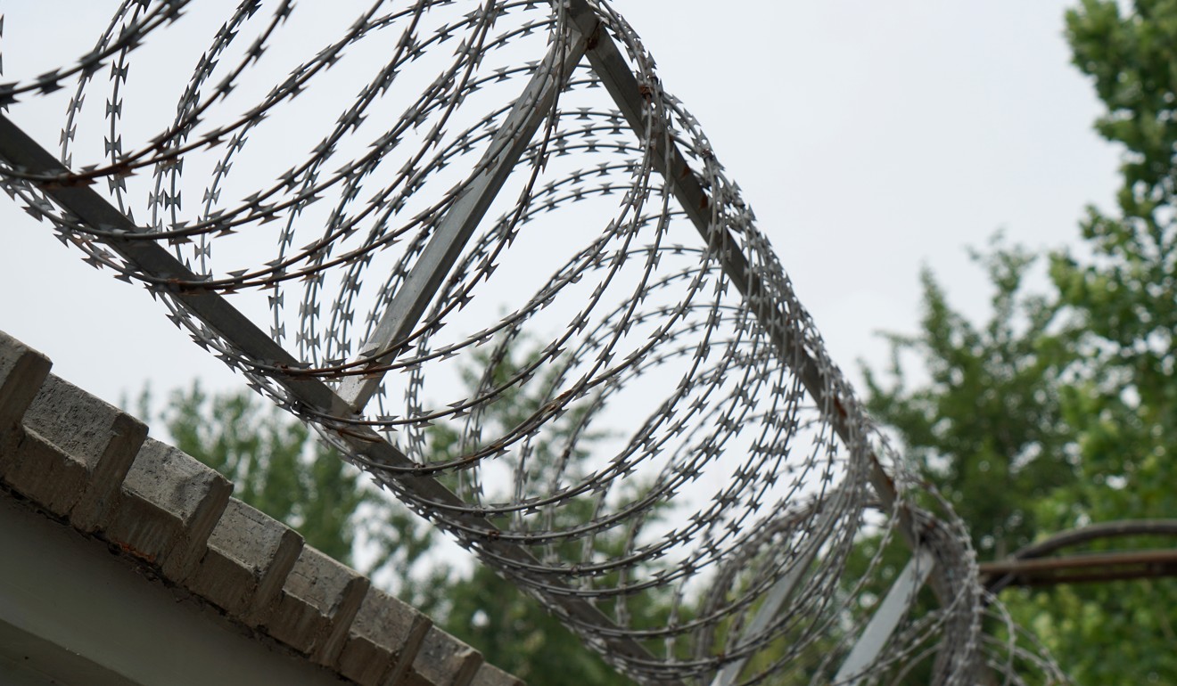 Security in the treatment centre resembles that of a prison. Gates and windows are locked and barbed wire is fixed atop the high walls. Photo: Lea Li