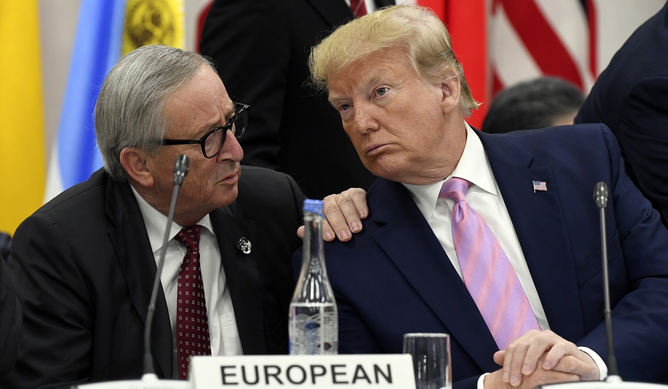 US President Donald Trump speaks to European Commission president Jean-Claude Juncker at the G20 summit in Osaka on Friday. Photo: AP