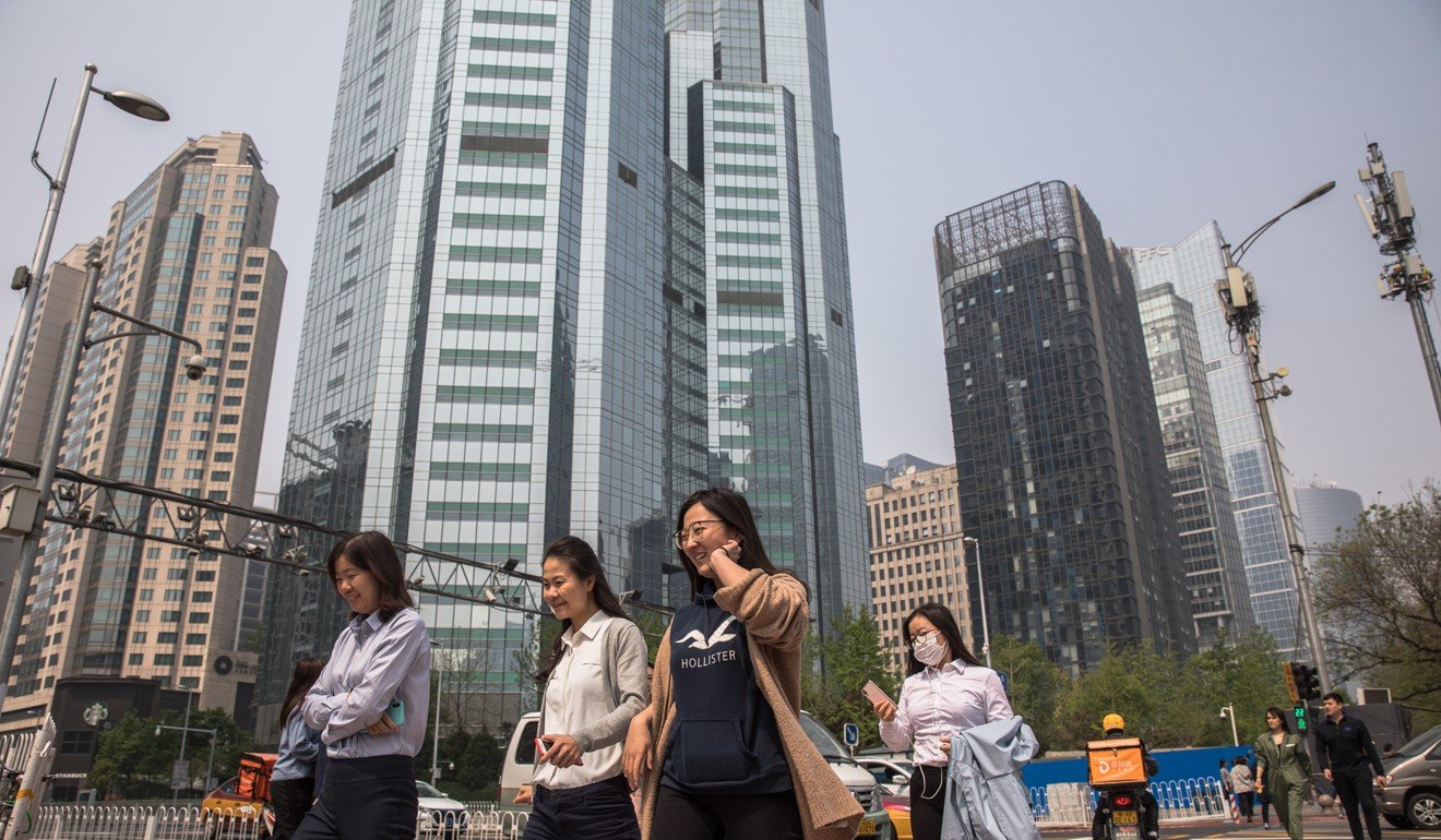 Pedestrians in Beijing in April. Self-storage units have become popular in the city, with dislocation a driving motivator. Photo: EPA