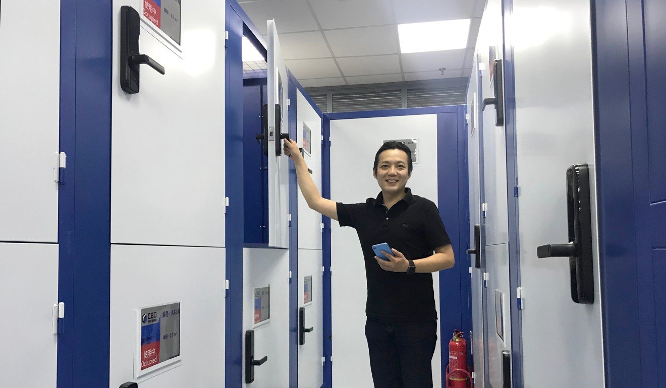 Alan Tso, founder of CBD self-storage, shows how customers open lockers with digital keys. Photo: Kimmy Chung