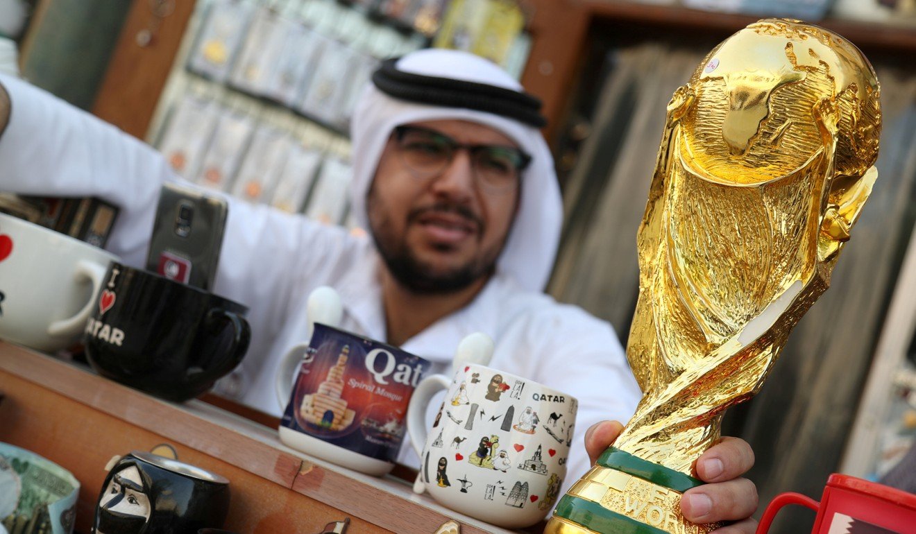 Market vendors selling mock World Cup trophies in Doha, Qatar. Photo: Reuters