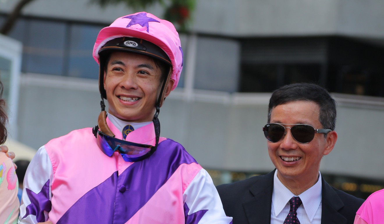 Trainer Benno Yung and jockey Derek Leung celebrate Super Junior’s victory.