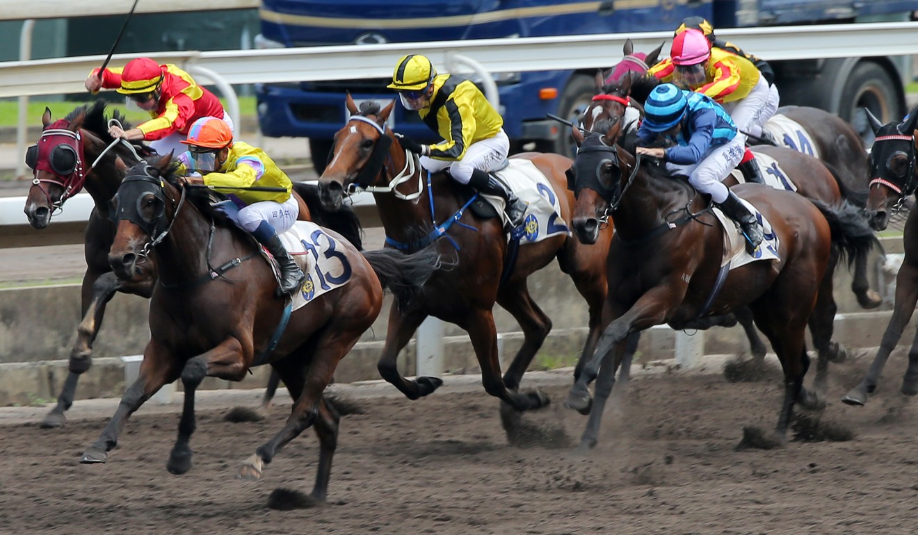 Hidden Spirit (left) surges to victory ahead of stablemate Mi Blanco (blue silks).