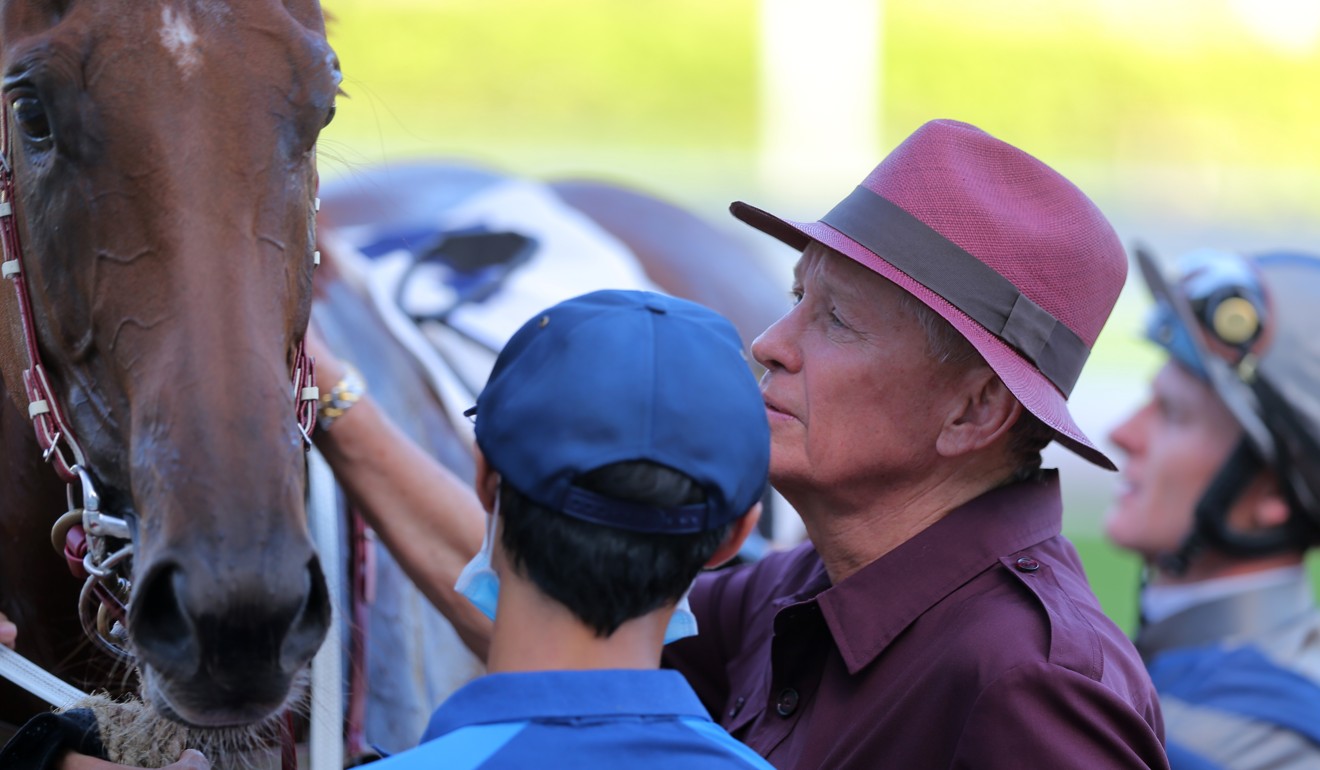 John Moore checks over Aethero after his dominant victory at Sha Tin.