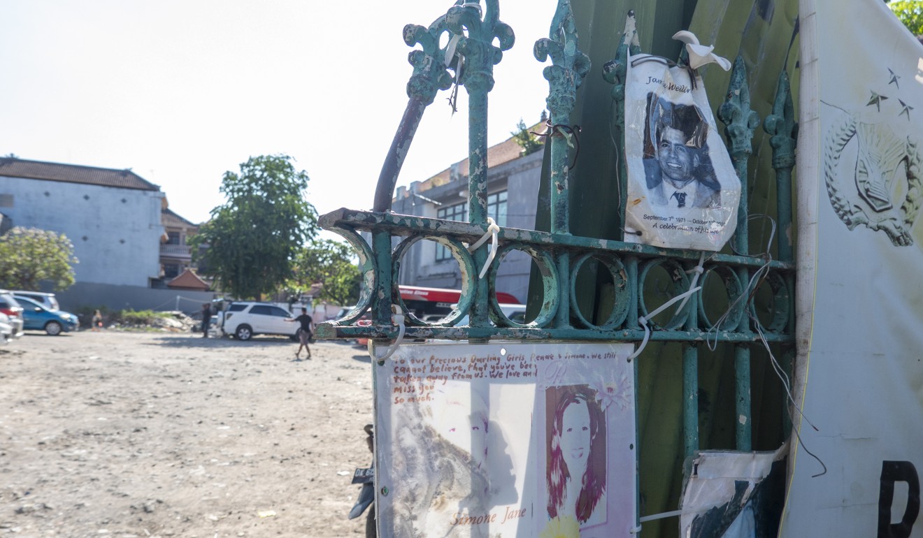 Pictures of victims attached to the fence of the former Sari Club, the site of the 2002 bombing in Kuta, Bali. Photo: EPA