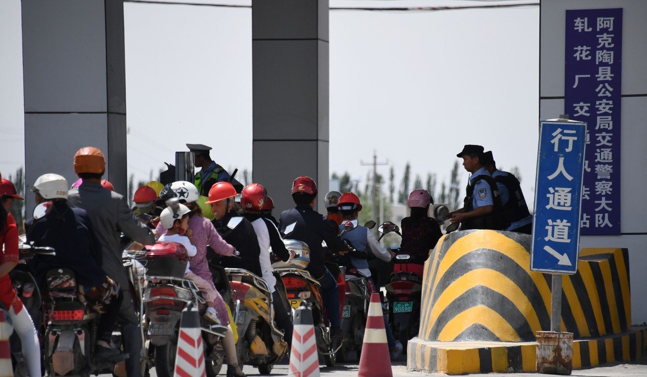 A police checkpoint on a road near a facility believed to be a re-education camp where mostly Muslim ethnic minorities are detained, north of Akto in China's western Xinjiang region. Photo: AFP
