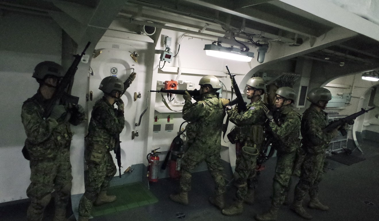 Japanese troops from the Amphibious Rapid Deployment Brigade position themselves during a training session. Photo: AP