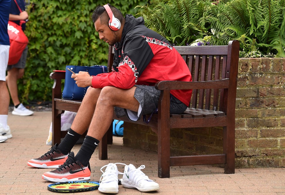 Nick Kyrgios arrives for a training session at the All England Club. Photo: AFP
