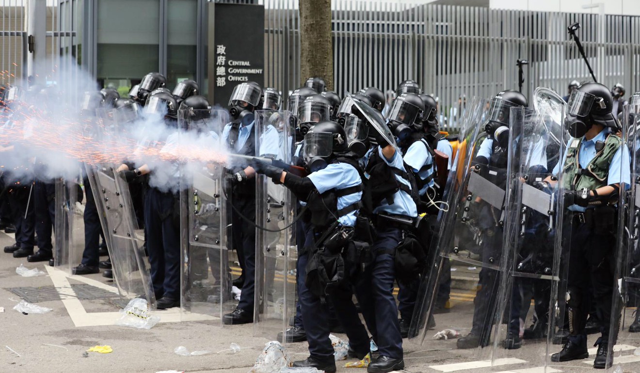 Police fire a tear gas canister on June 12. Photo: Sam Tsang