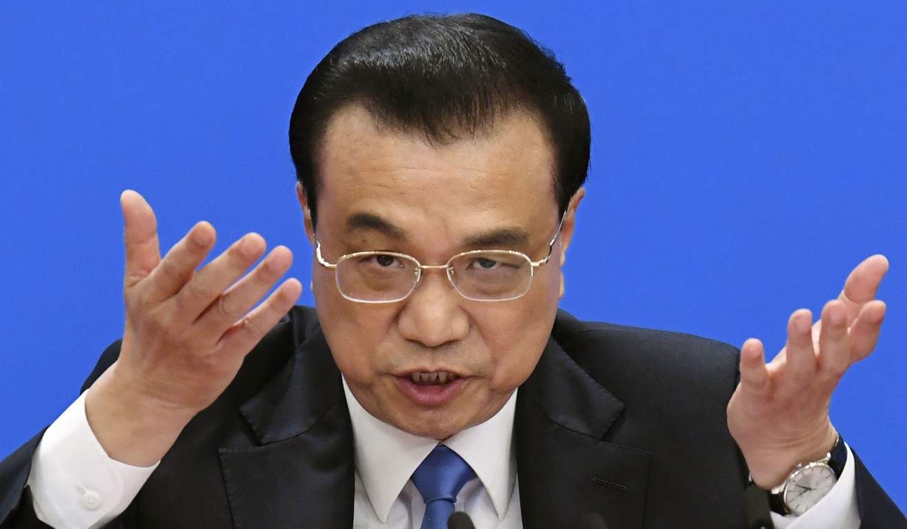 Chinese Premier Li Keqiang says Beijing aims to lower borrowing costs to help businesses amid the economic slowdown. Photo: Kyodo