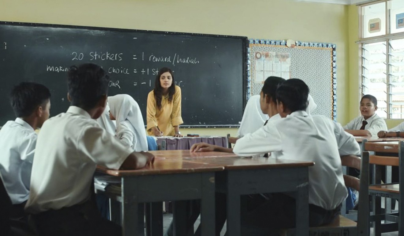 Sangeeta Krishnasamy plays a rural schoolteacher in Adiwiraku.