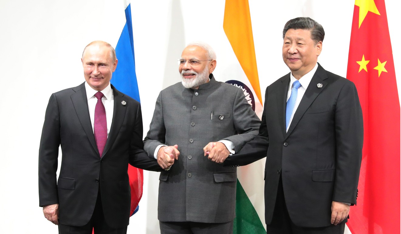 Russian President Vladimir Putin, Indian Prime Minister Narendra Modi and Chinese President Xi Jinping on the sidelines of the G20 summit in Osaka. Photo: EPA