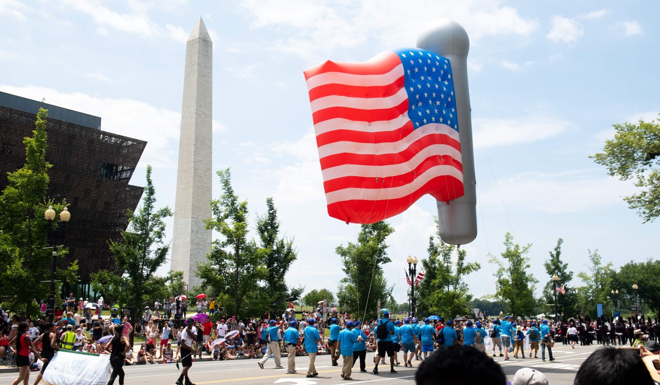 People watch the Fourth of July parade in Washington on Thursday. Photo: AFP