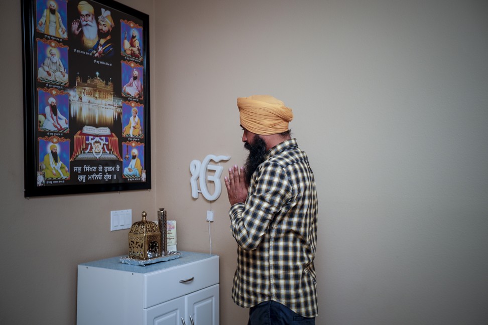 Singh offering prayers at his home before leaving on week-long trip to Indiana. Photo: TNS