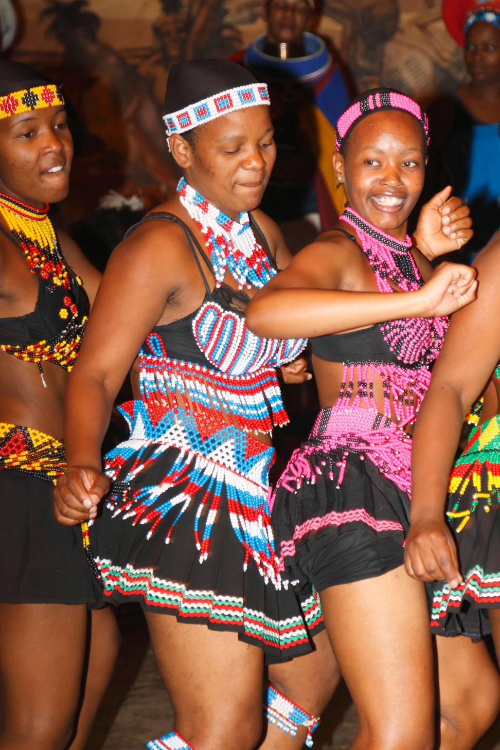 Young Zulu girls dancing in traditional beady dresses. Photo: Alamy