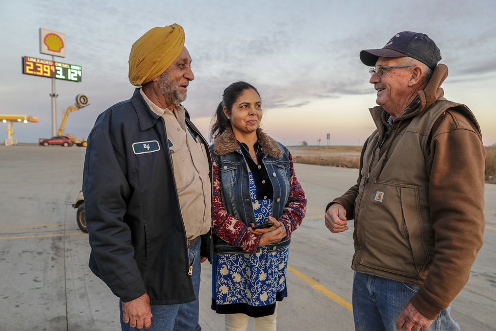 Raj Singh (left) and his wife Harpreet at Truck Stop 40, along I-40, chatting with neighbour Kenny Drake. The Singhs own the truck stop. Photo: TNS