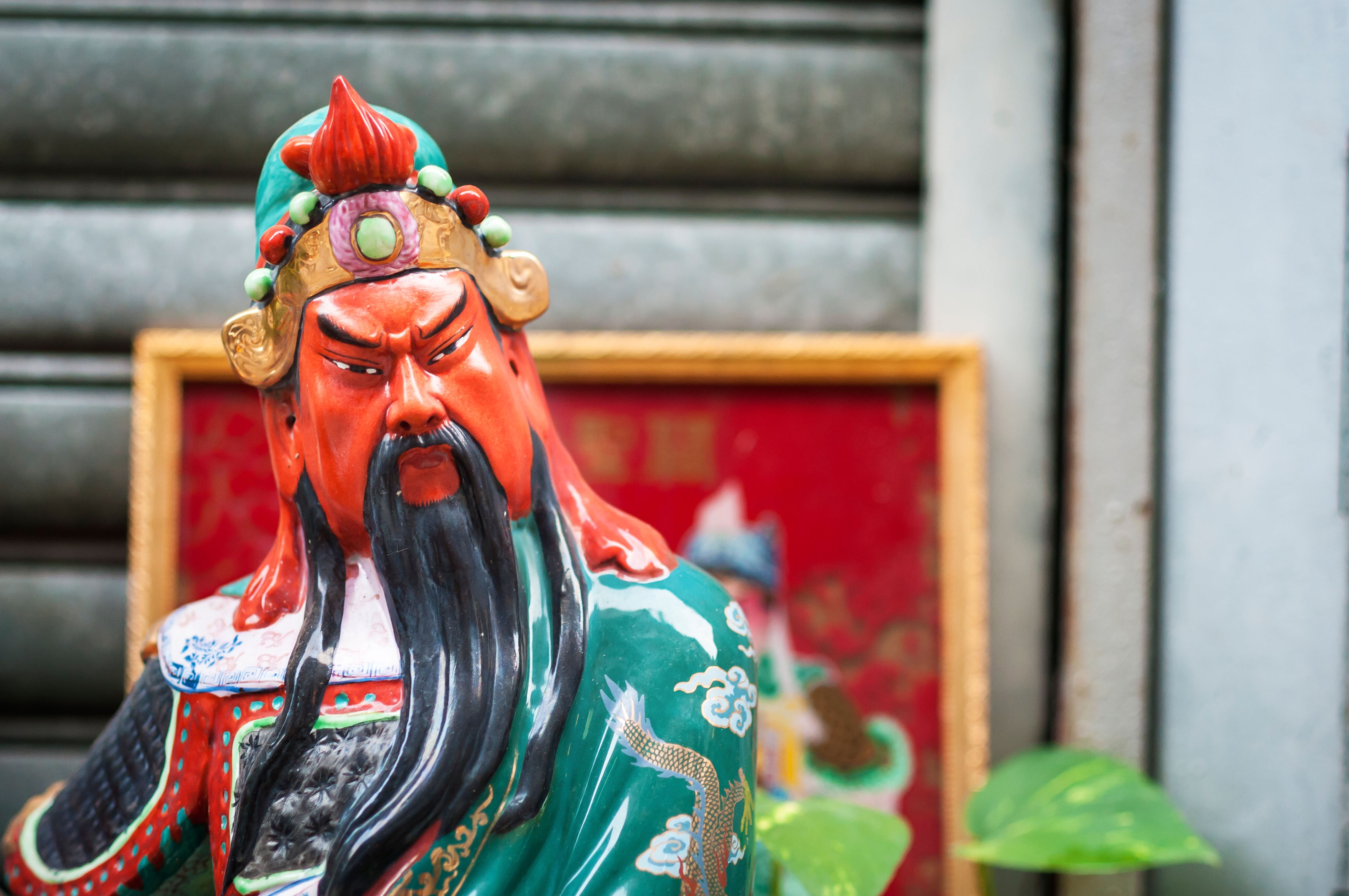 Guan Yu depicted in his red-face glory at a street shrine in Hong Kong. Photo: Alamy