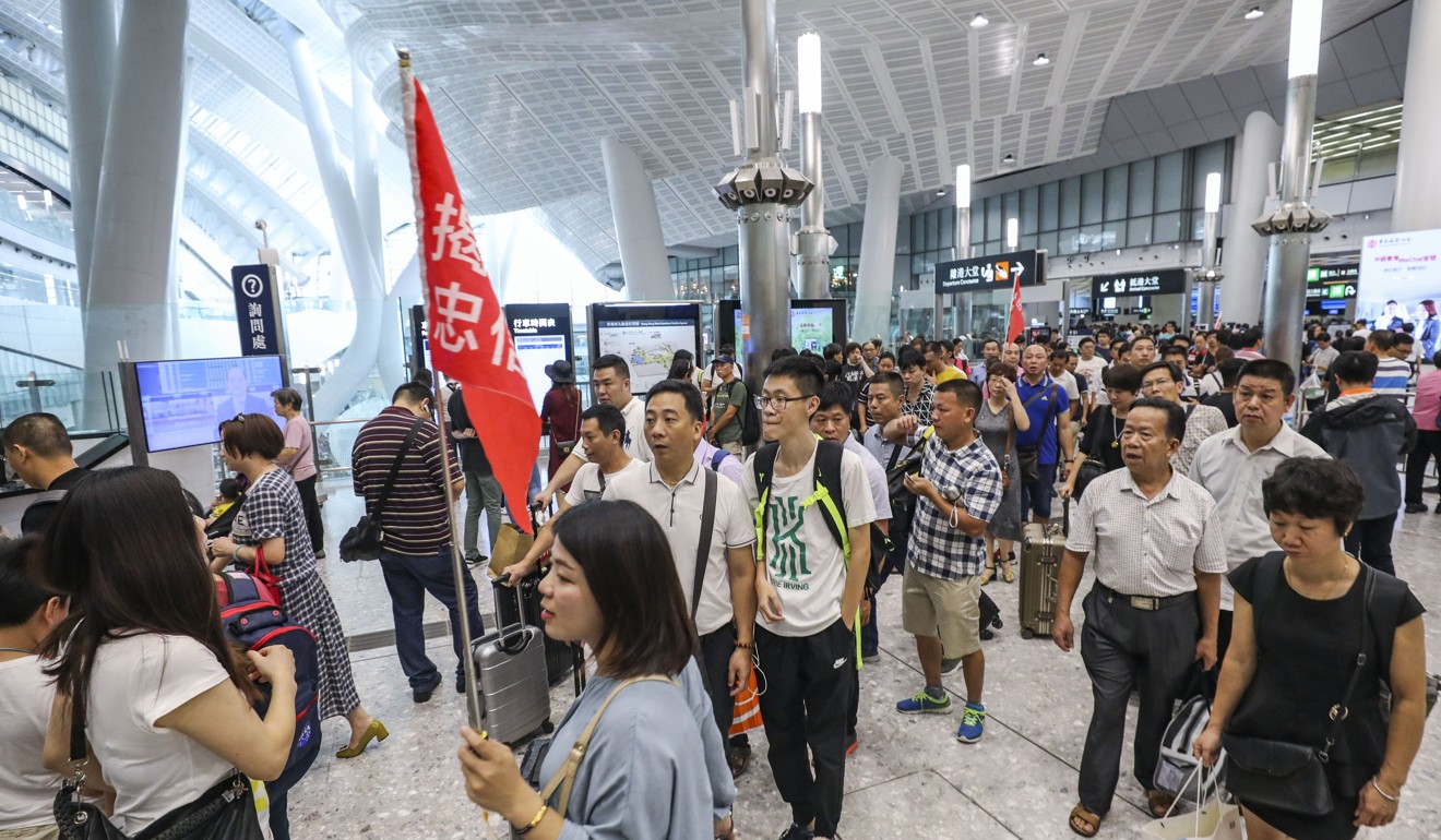 Mainland Chinese tourists arrive at West Kowloon cross-border high-speed rail terminus. Photo: Felix Wong