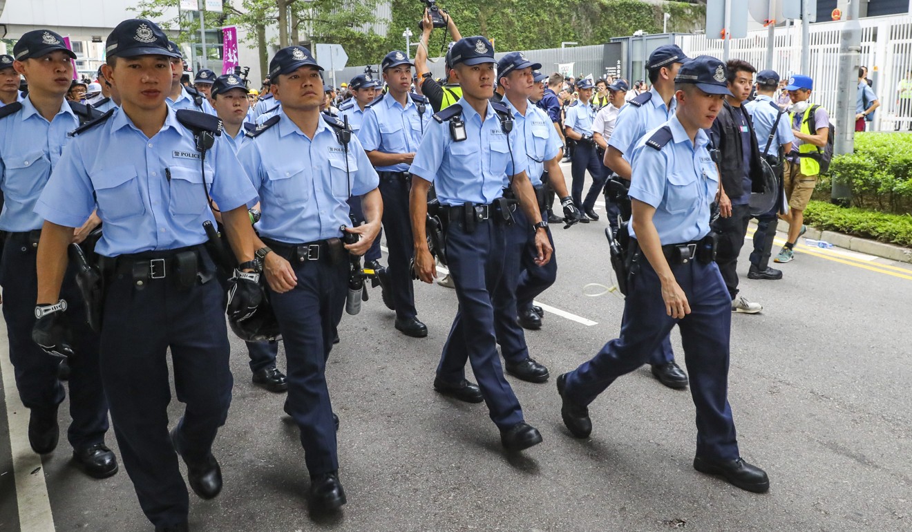 Police officers near the Central Government Offices in Tamar during the extradition bill protest on June 16. Photo: Edmond So