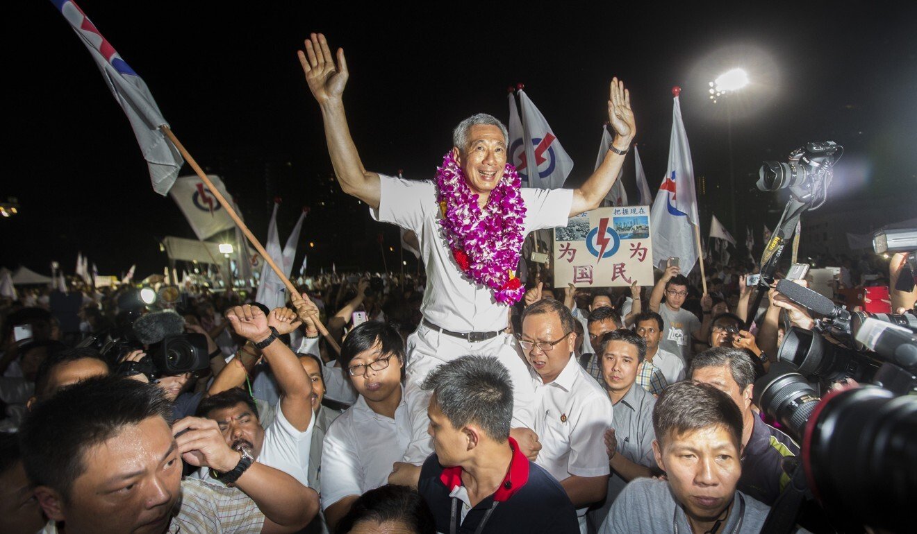 Lee Hsien Loong, Singapore’s prime minister and leader of the People’s Action Party, celebrates with supporters at an election results rally in 2015. Photo: Bloomberg