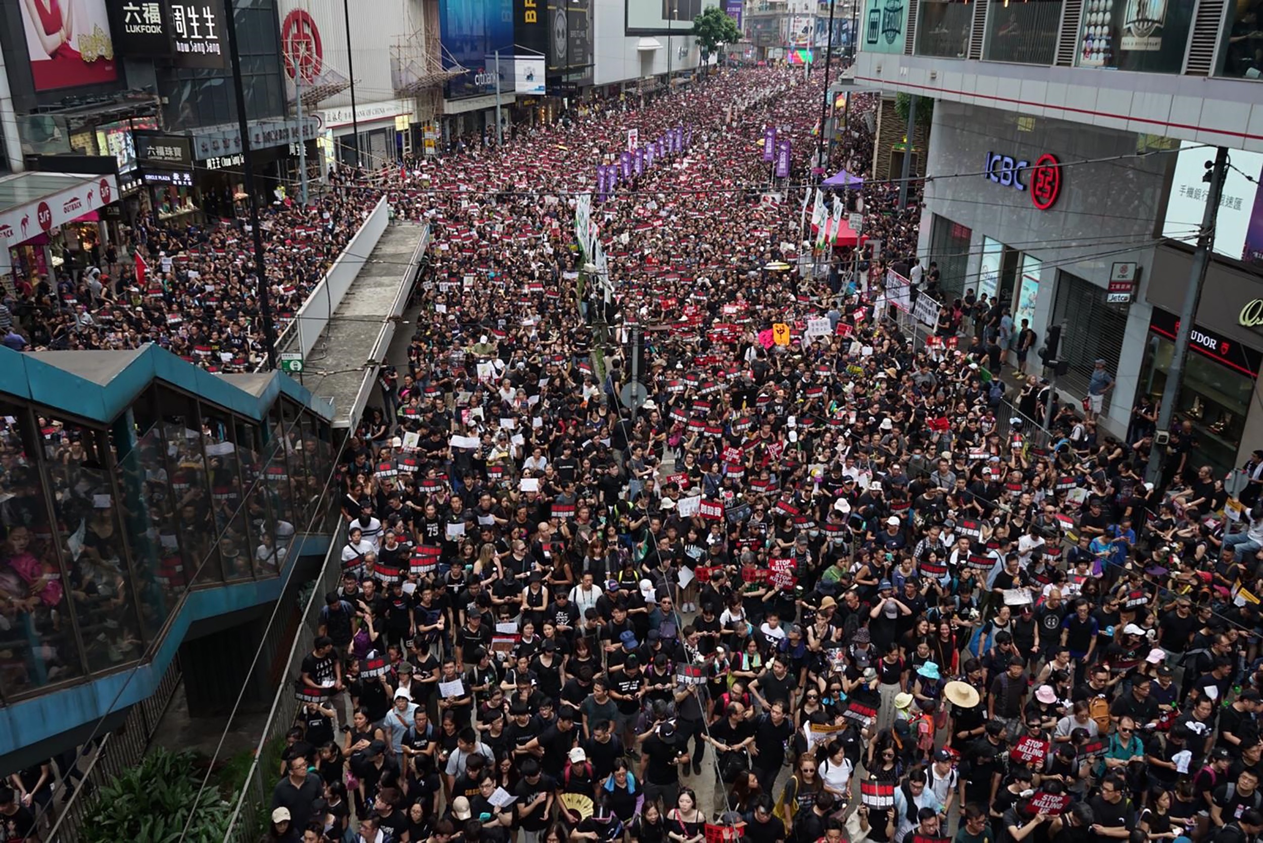 Protesters make their way along Hennessy Road near Causeway Bay in a massive show of solidarity and defiance against the extradition bill, on June 16, 2019. Such protests last month affected retail sales in the city. Photo: Joanne Ma
