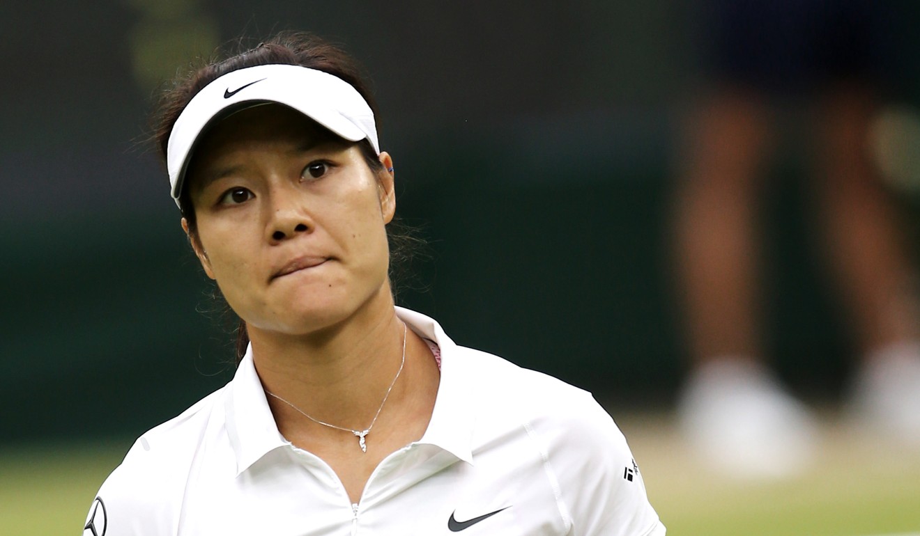 Li Na reacts during her quarter-final loss to Agnieszka Radwanska in 2013. Photo: Xinhua