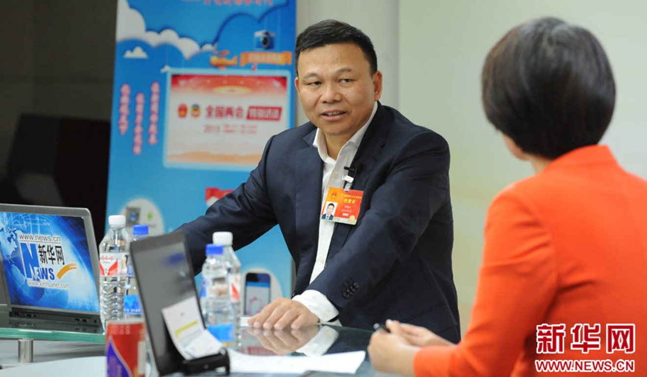 Zheng Jianjiang, seen in an interview with a TV presenter, made his fortune manufacturing air conditioners. Photo: Xinhua