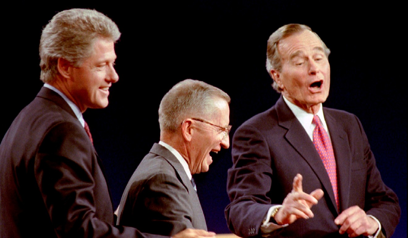 Bill Clinton (left), Perot (centre) and then president George Bush laugh at the conclusion of a presidential debate in 1992. Photo: Reuters